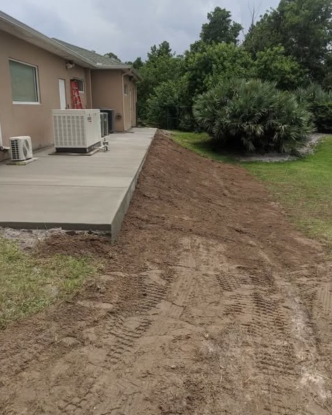 Stucco Home Concrete Patio in Wilmington, NC